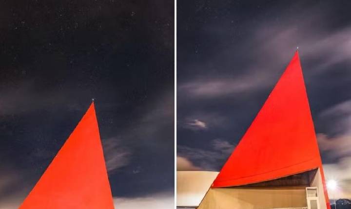 Foto mostra estrela que representa Goiás na bandeira nacional no topo de cartão-postal de Goiânia