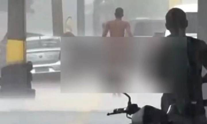 Homem anda pelado na rua durante a chuva em Goiânia