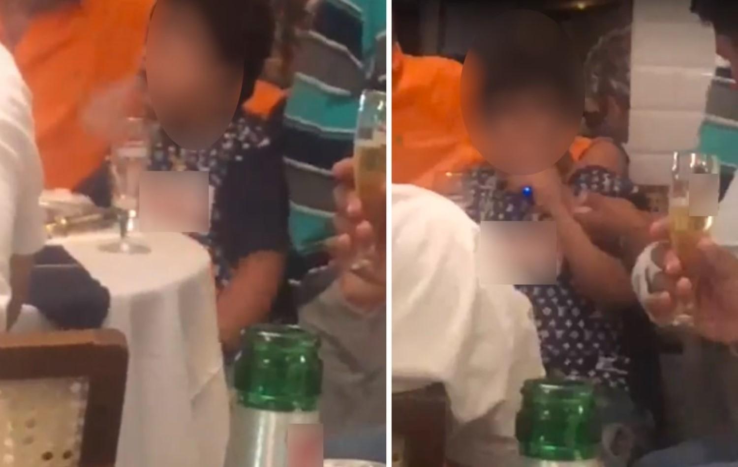 Criança é filmada fumando cigarro eletrônico e bebendo coquetel na companhia de adultos em bar de Goiânia