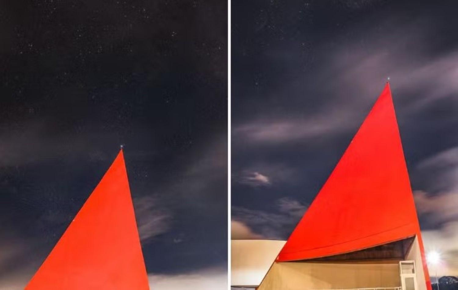 Foto mostra estrela que representa Goiás na bandeira nacional no topo de cartão-postal de Goiânia